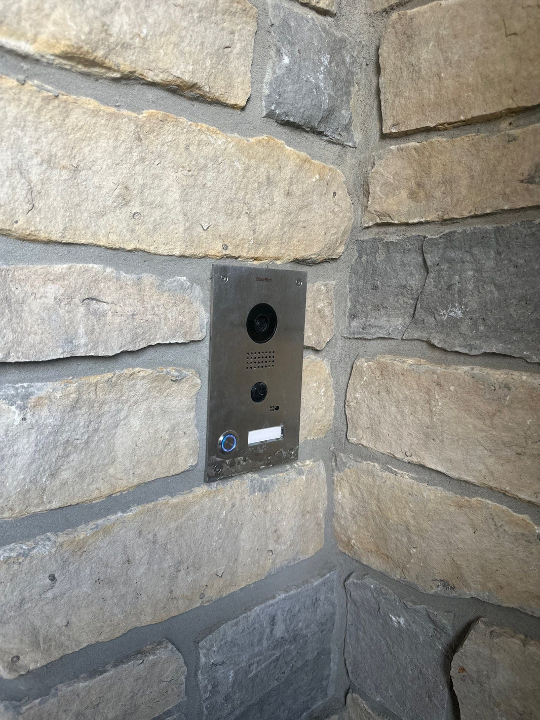Video intercom mounted in a stone wall