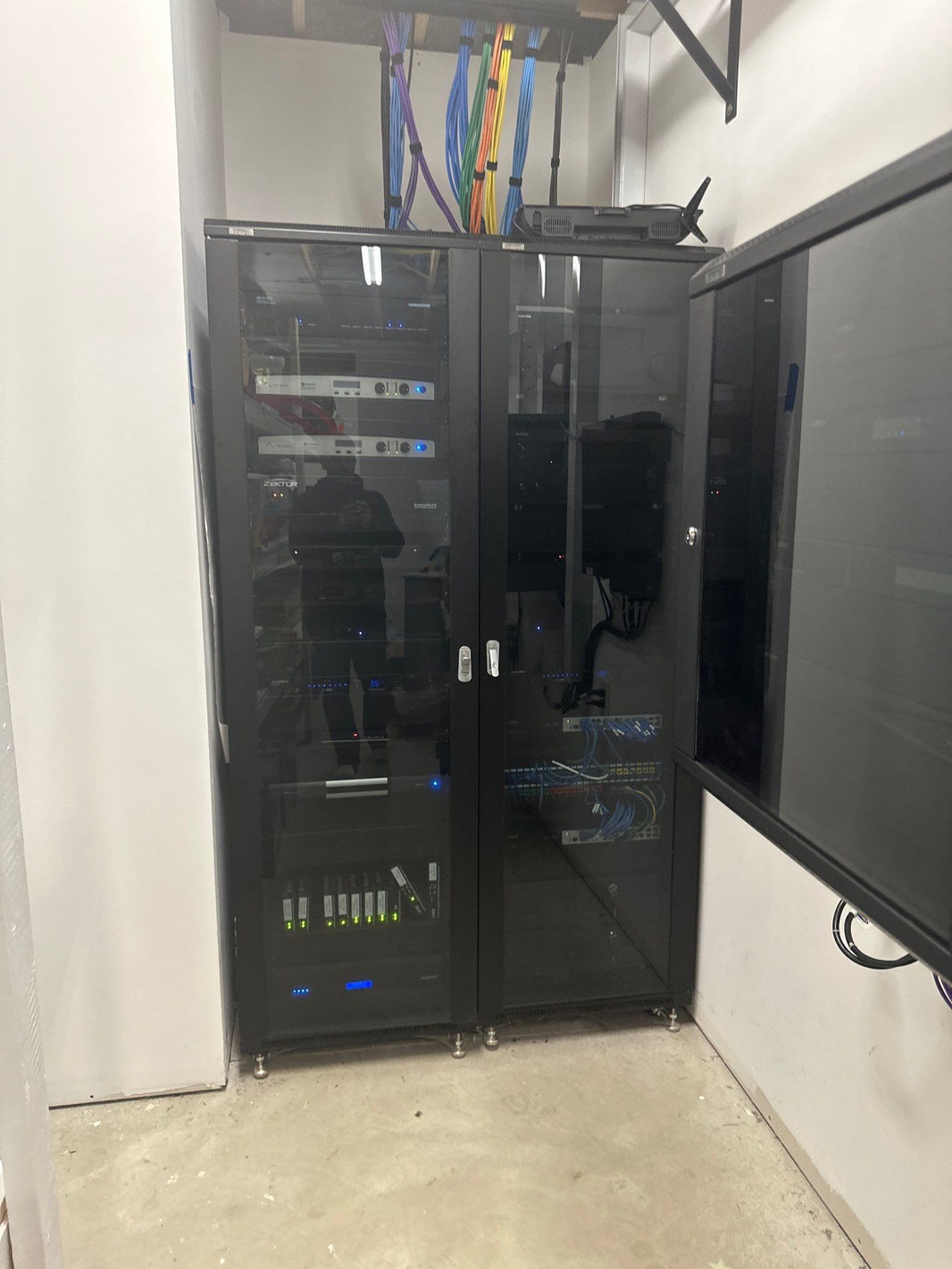 Equipment rack in a glass-door cabinet