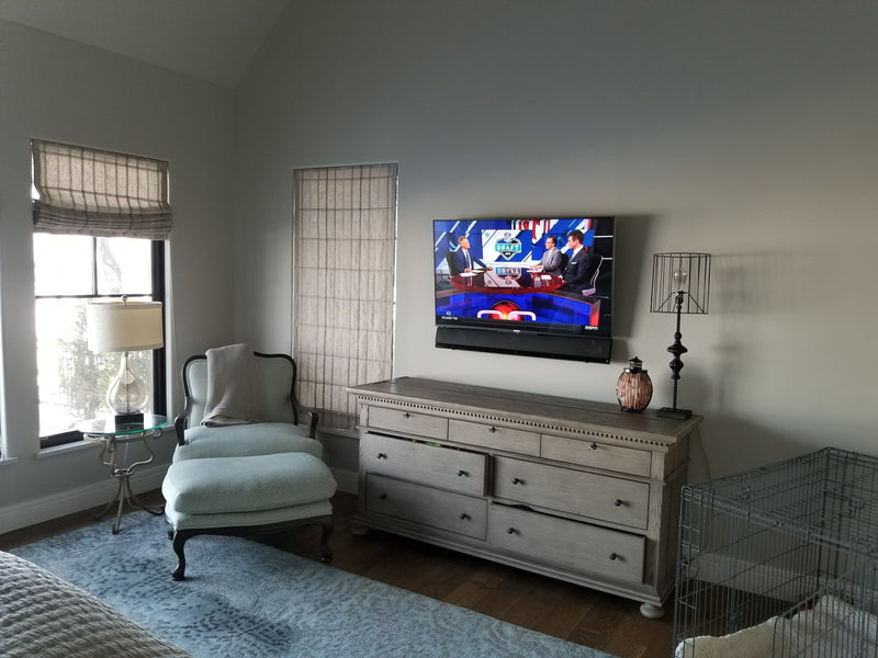 Bedroom TV above a dresser