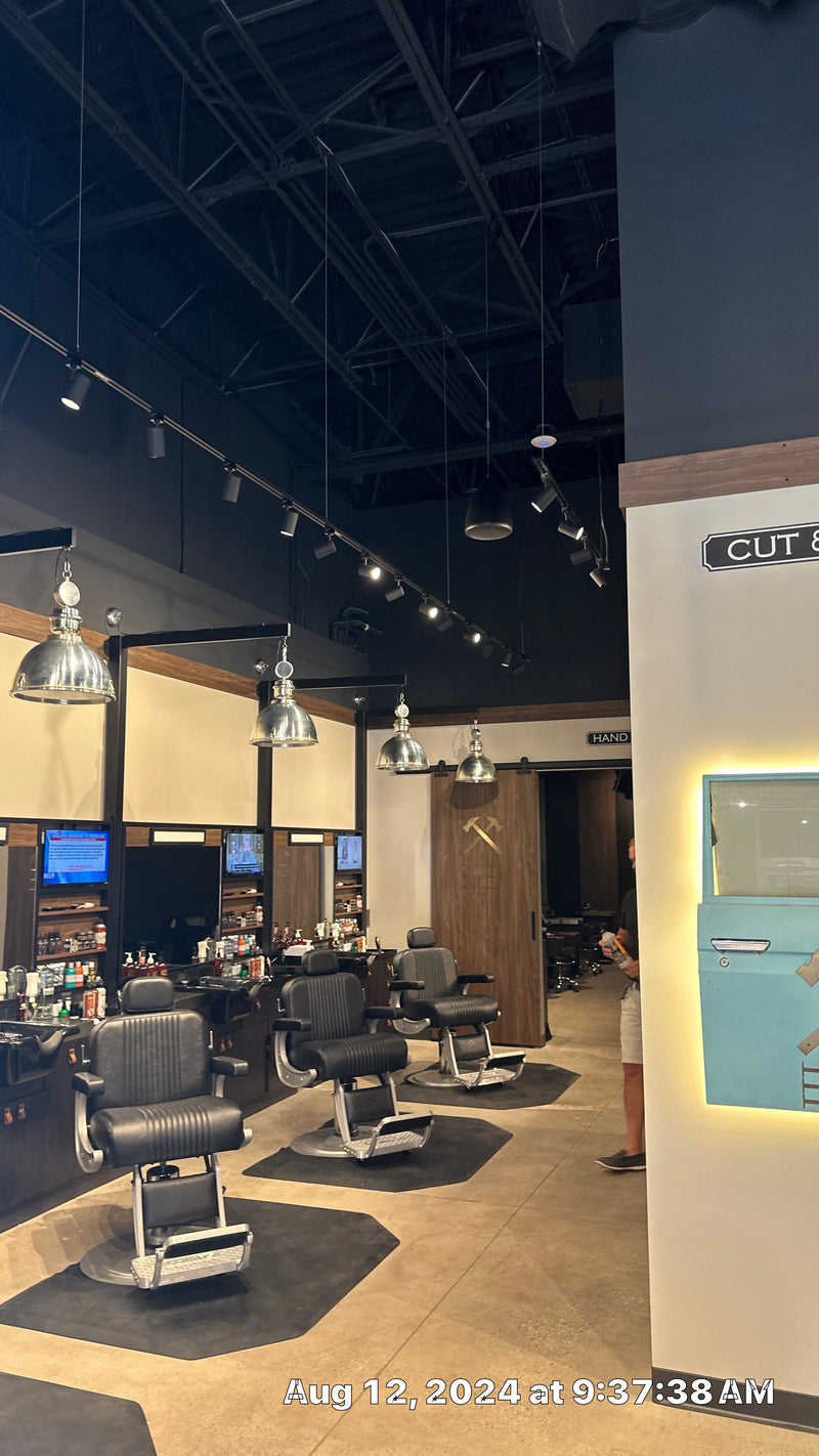 Lounge with pendant lights and station TVs