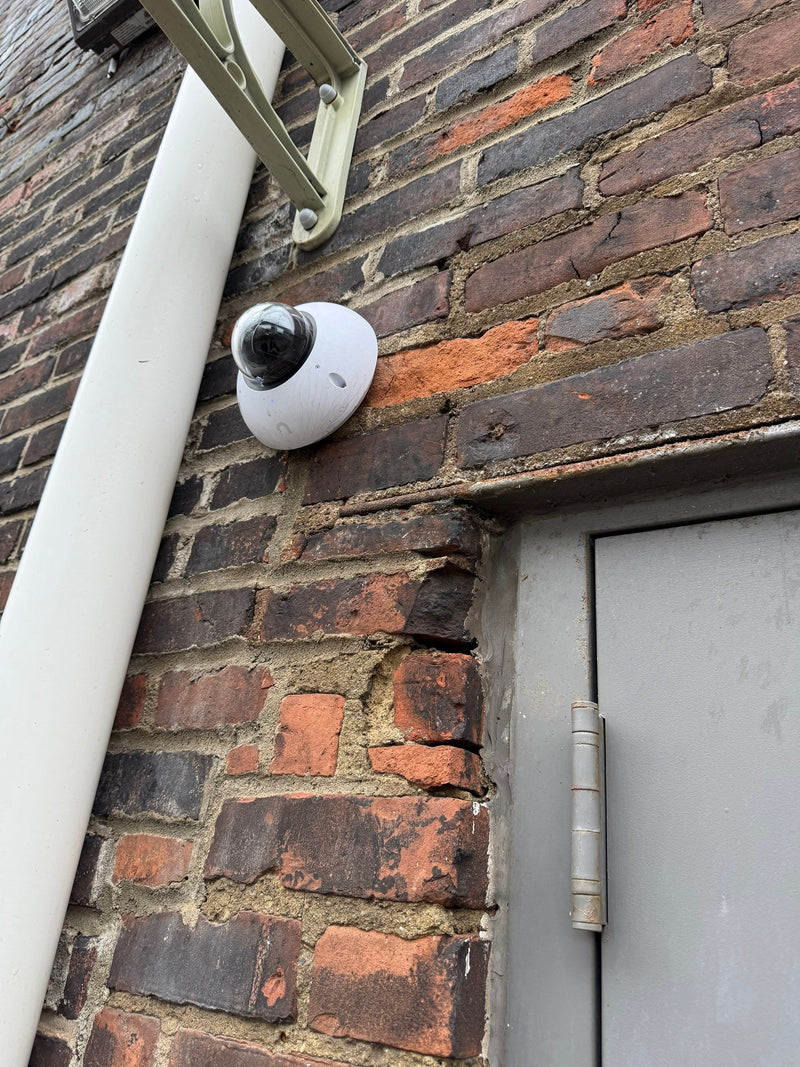 Exterior security camera on brick