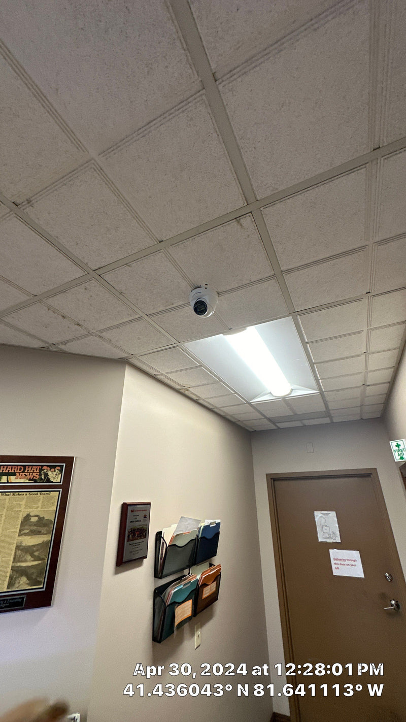 Ceiling camera in an office hallway