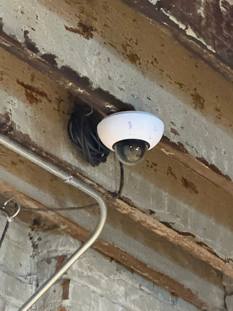Dome security camera on an industrial ceiling