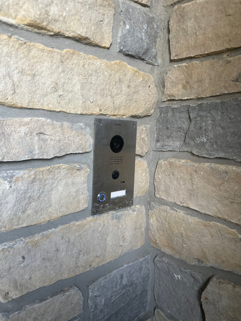 Video intercom mounted in a stone wall