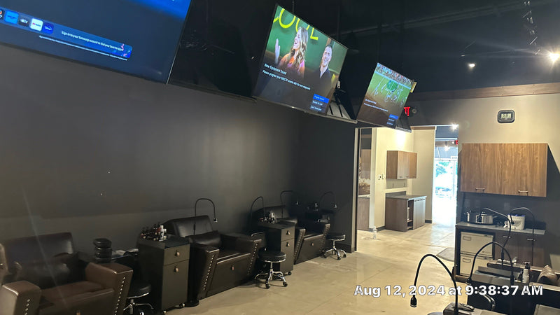 Angled TVs above the pedicure chairs
