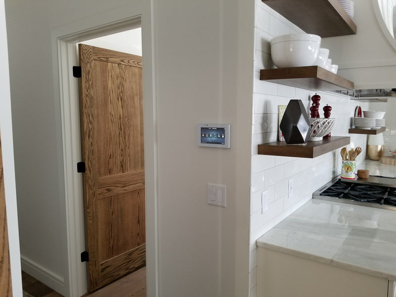 Wall touchscreen by a doorway